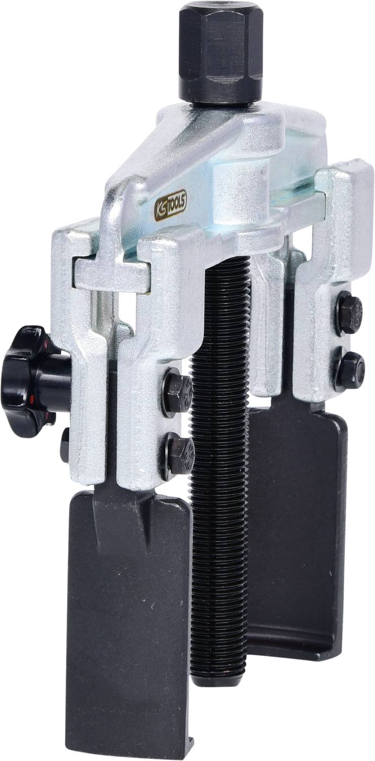 Two-armed metal puller with screw mechanism, used for loosening or removing tightly fitted parts such as bearings.