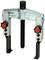 Two-armed puller with two red handles and central thread, for safely removing bearings or gears from shafts.