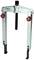 A two-arm metal puller with a central threaded bolt and red turning knobs, suitable for removing bearings or gears.