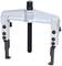 "Two-legged puller with metal frame and black screw in the centre, used for removing bearings or gears."<br><br>Note: This translation uses British English spelling (centre instead of center) and maintains the technical terminology of the original German text.