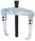 Two-armed metal puller with screw mechanism in the centre, suitable for removing stuck parts in machinery.