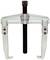 Two-legged metal puller, used for removing gears or bearings from shafts, with adjustable arms.