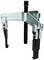 Three-legged metal puller with screw mechanism, for removing stuck parts such as gears or bearings from a shaft.