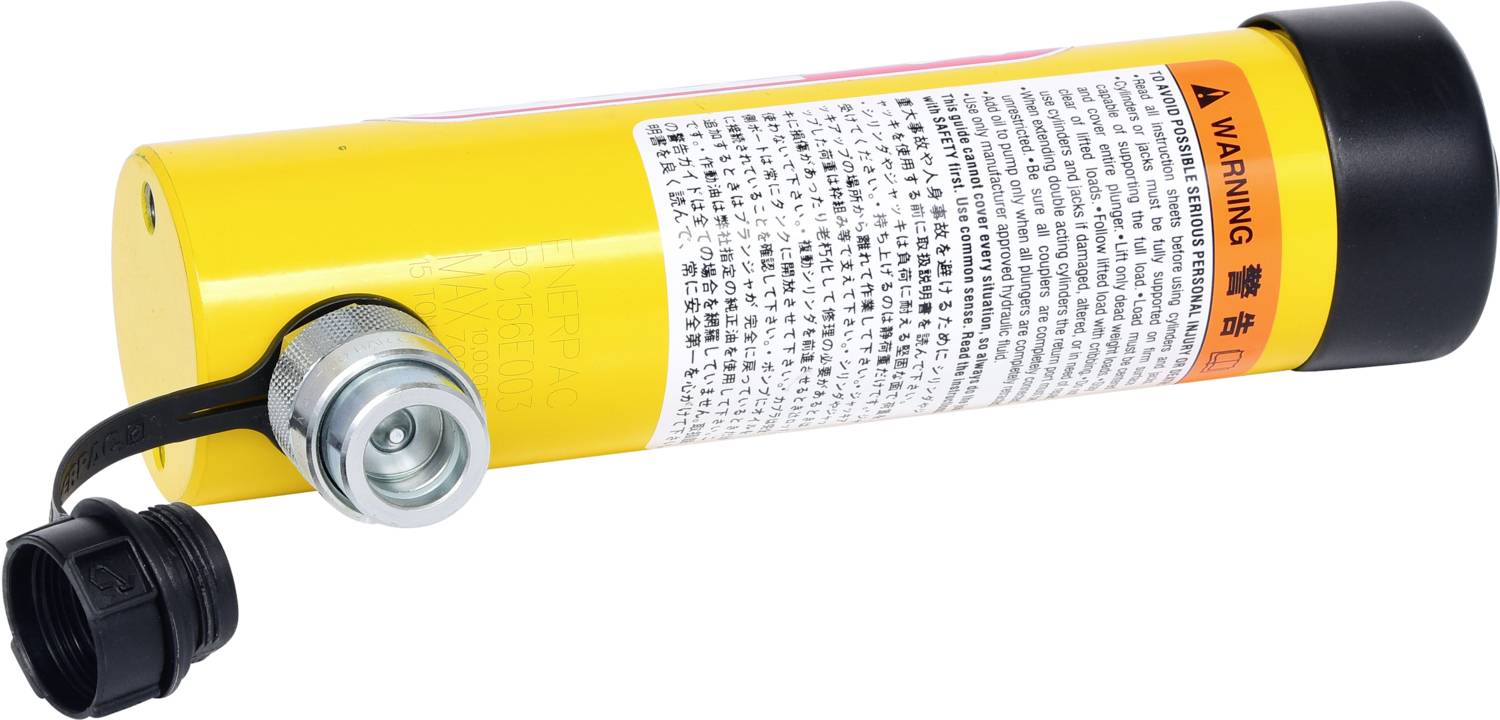 Yellow cylinder with warning notices and safety cap on a nozzle.