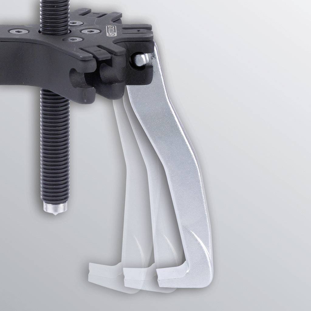 A three-legged metal puller with a screw mechanism, used for removing stuck parts in machines or vehicles.