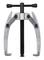 Two-armed metal puller with a central screw for removing wheel bearings or other mechanical components.