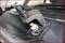 A tool for removing a windscreen wiper arm, attached at the base of a car's windscreen wiper.