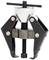 A black puller with a silver handle, used for removing parts, consisting of two arms and a central screw.