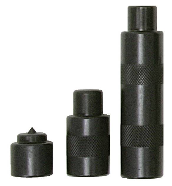 Three black metal stamps of different sizes with knurled surfaces stand upright side by side.