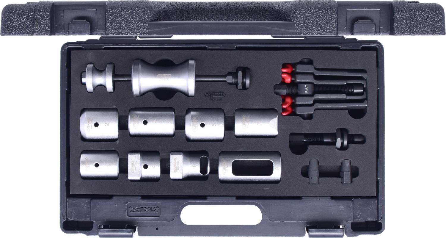 An open toolbox with various car repair tools, including metal sleeves and a red handle attachment.
