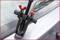 A windscreen wiper removal tool is attached to the windscreen. It is used to remove the wiper mechanism.