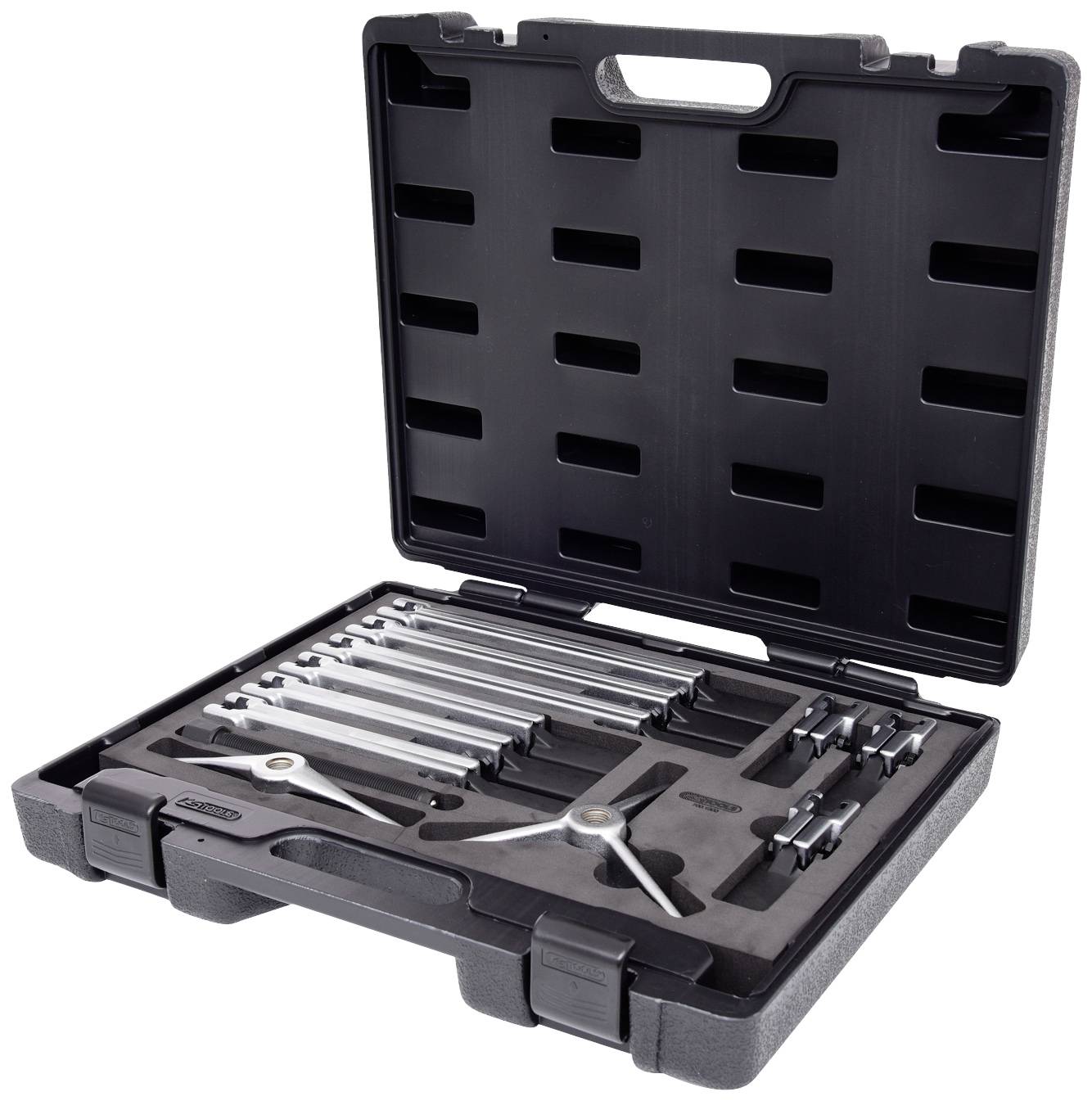 An open black toolbox with various metal tools, including a large compass and several drawing instruments.
