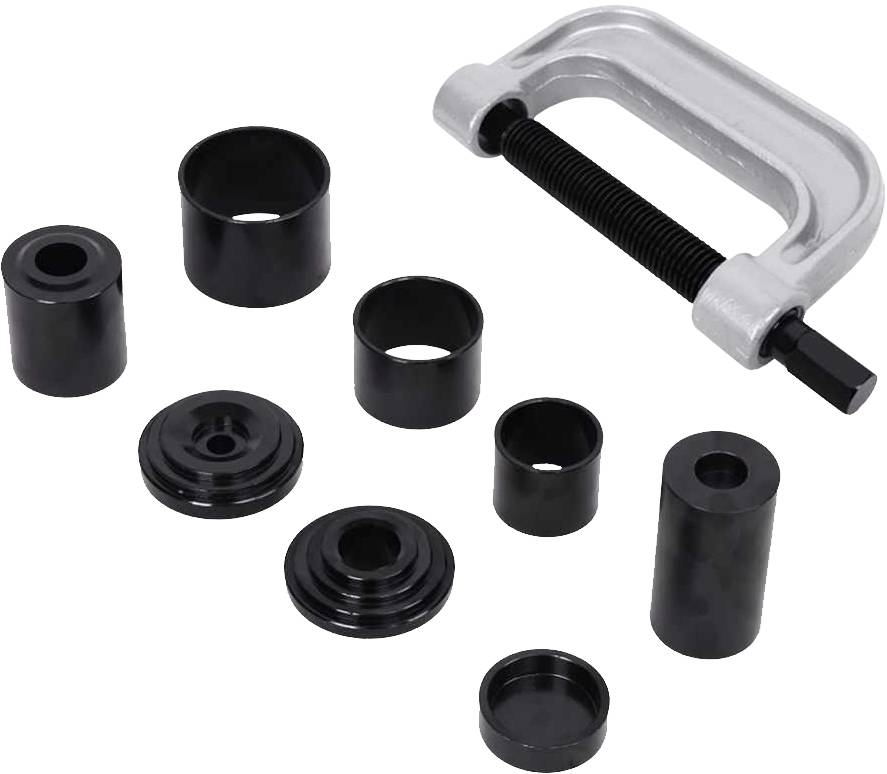A set of automotive tools for removing bushes, comprising a screw clamp and various metal attachments.