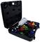 An open black tool case with various coloured circular attachments and a white plastic bottle.