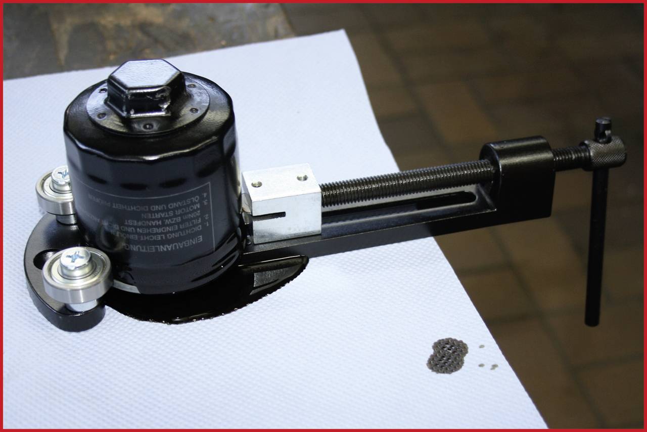 Tool for creating circular cut-outs in sheet metal. It has a cutting part with a lever and a central screw for fixation.