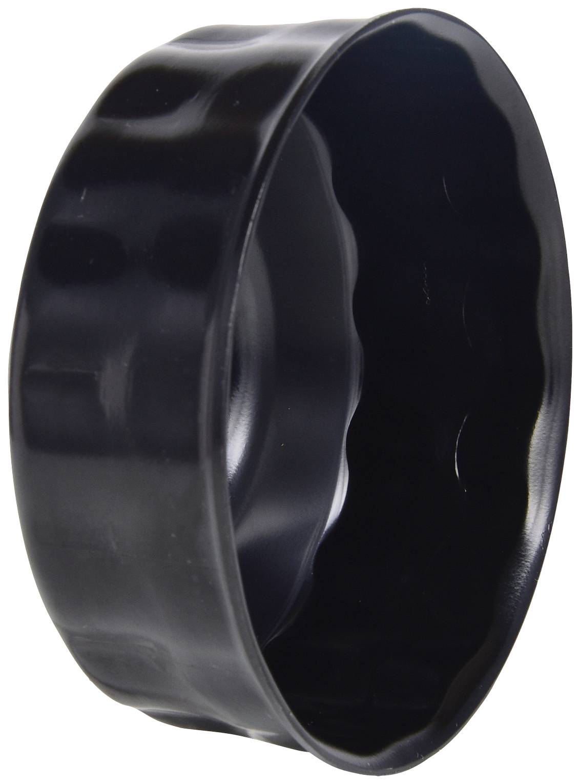 'Black, wavy round sheet metal, potentially usable as a baking tin or lid.'