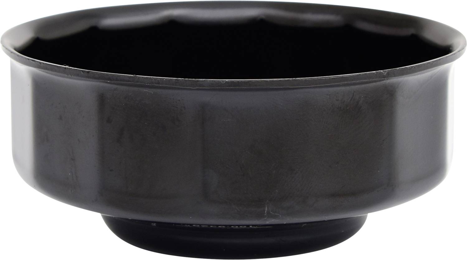 A black, flat bowl with a smooth surface.