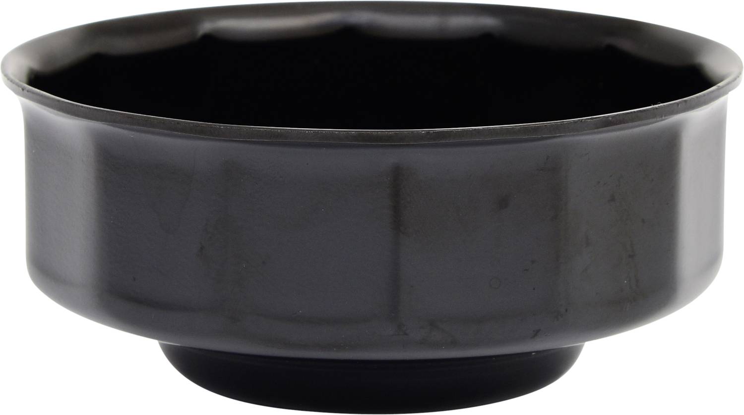 A simple, black ceramic bowl with a wavy rim.