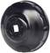 Metal oil filter cap, black, round with serrated edge. Used for removing or installing oil filters in vehicles.