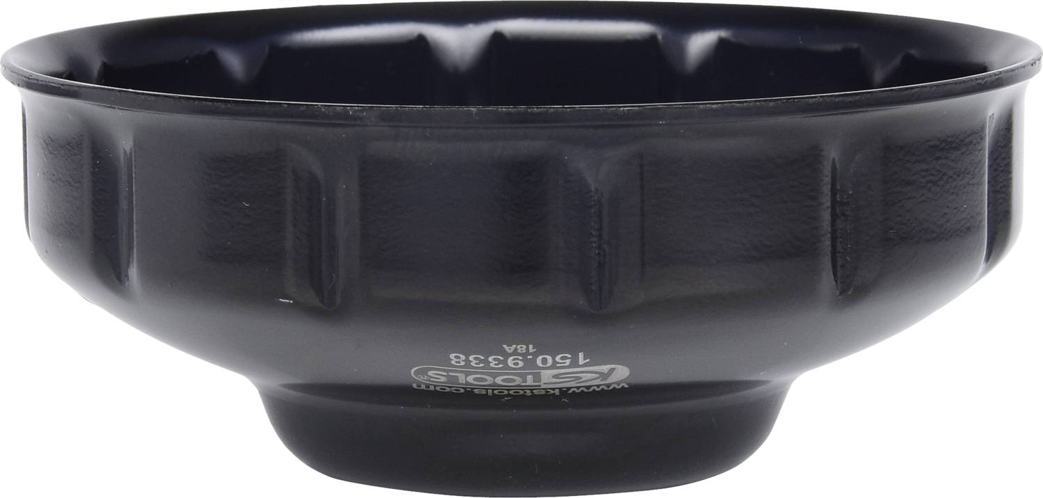 A black plastic oil drip tray, cylindrical in shape, with ribbed sides for better grip and a label on the underside.