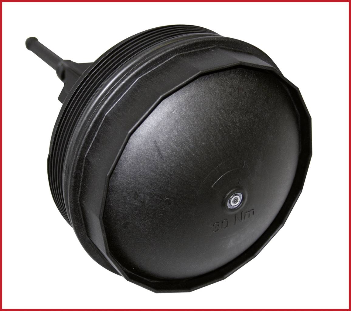 Black, round engine cover with a ridged edge and a pointed stem; serves to cover and protect motor components in the vehicle.
