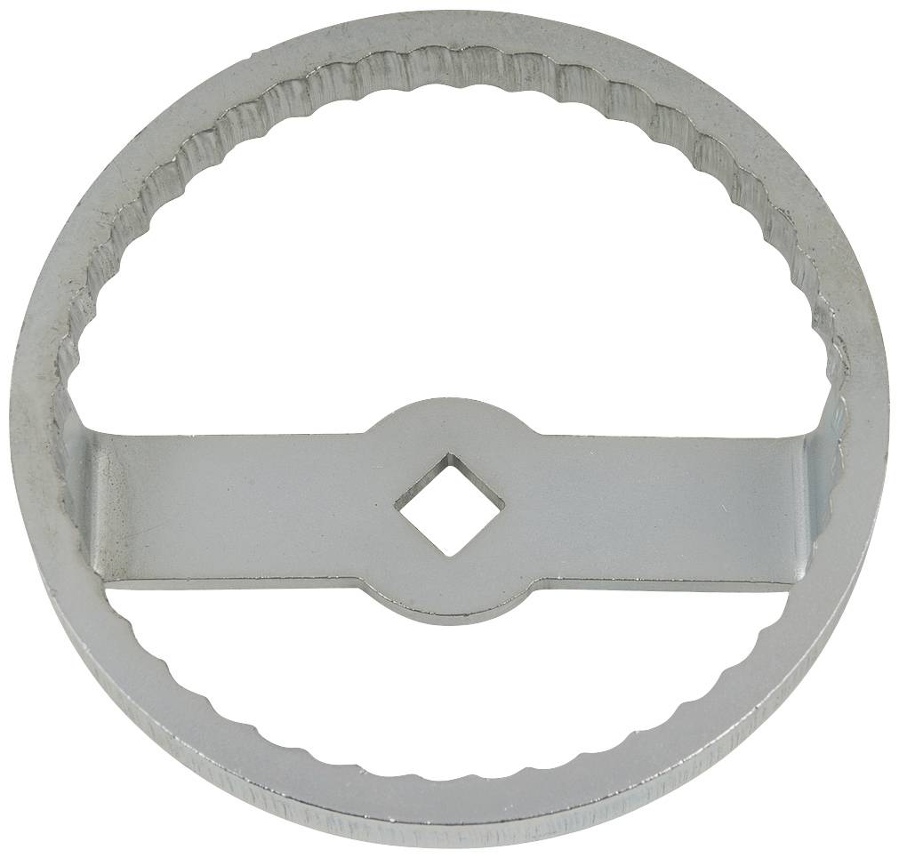 Round metal tool with a serrated edge and a central cross bar. A square hole in the centre.