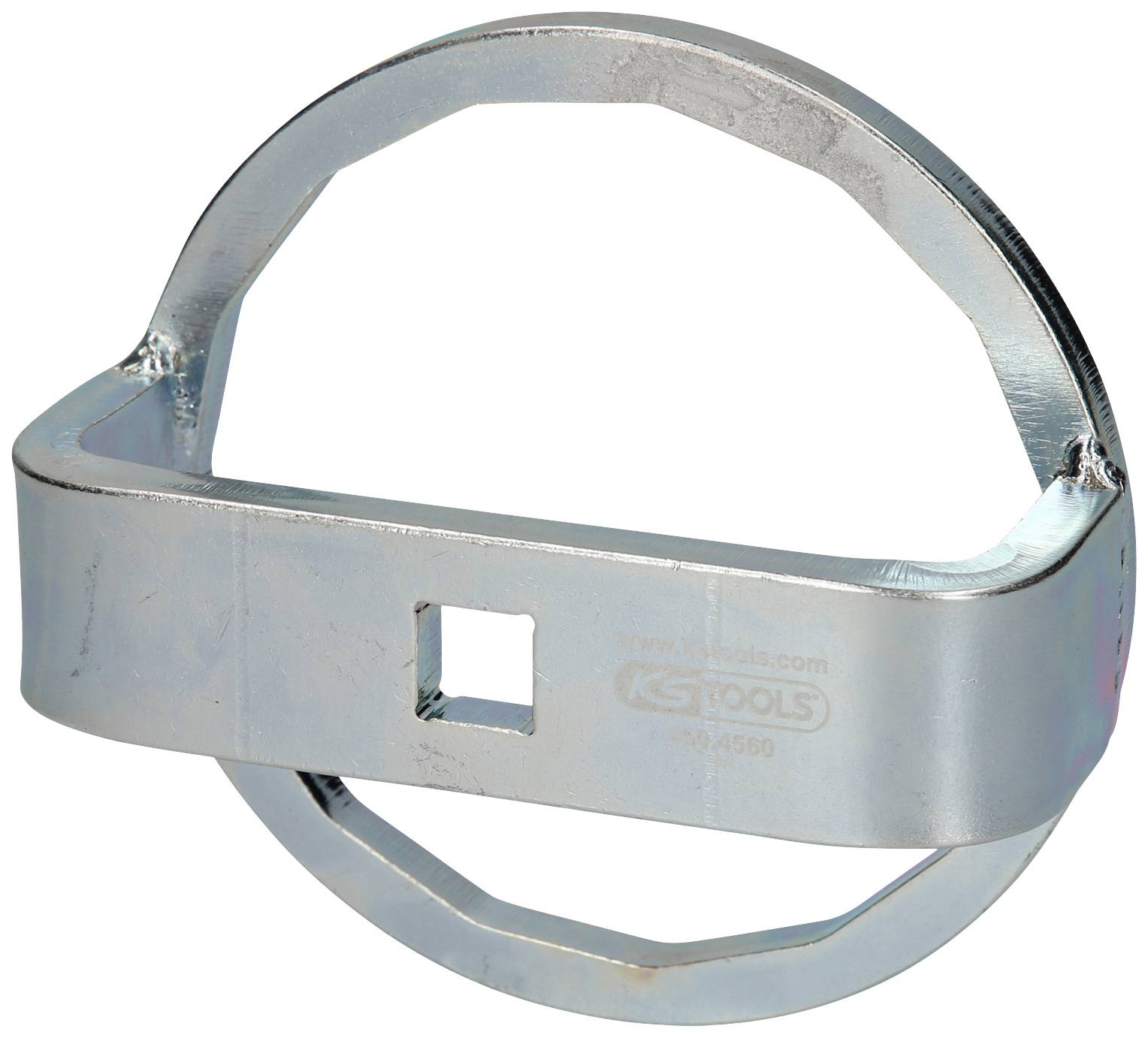 Metallic key in a circular shape, presumably a specialist tool for loosening or fastening specific screws or nuts.