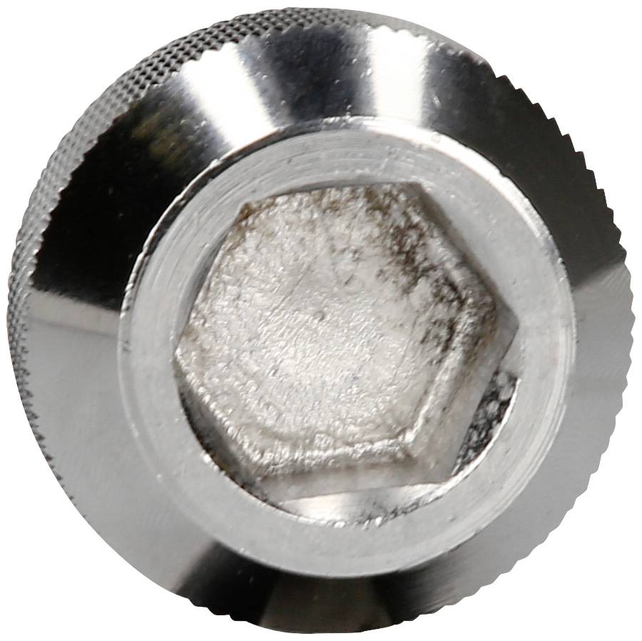 Metal hexagonal bolt viewed from above. It has a shiny, silver surface.