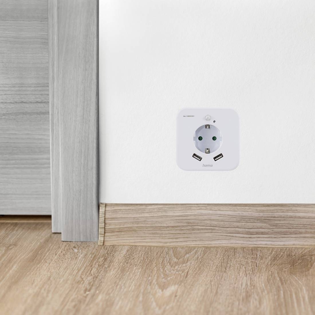 A white wall socket in a wooden wall, surrounded by elegant wooden flooring, gleams in a well-lit room.
