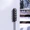Multiple socket outlet on an exterior wall, snow-covered landscape in the background. Ideal for outdoor winter power supply.