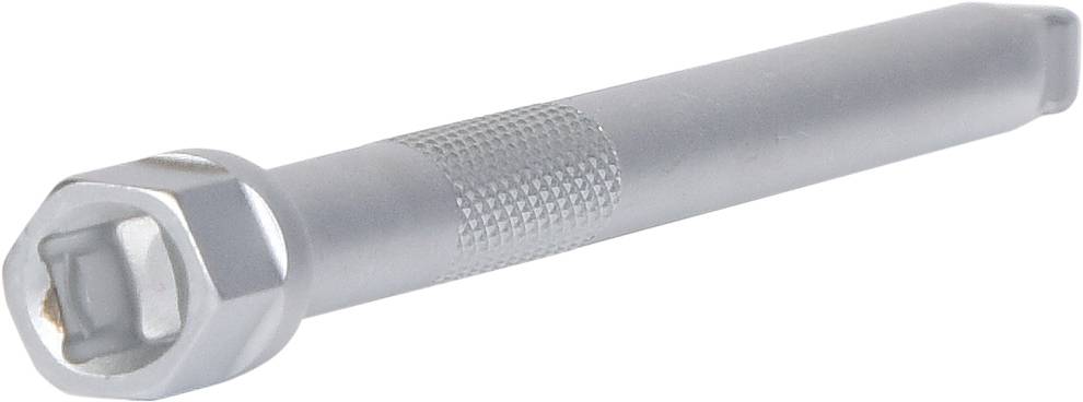 A grey, round metal pin with a ridged surface in the middle lies diagonally.