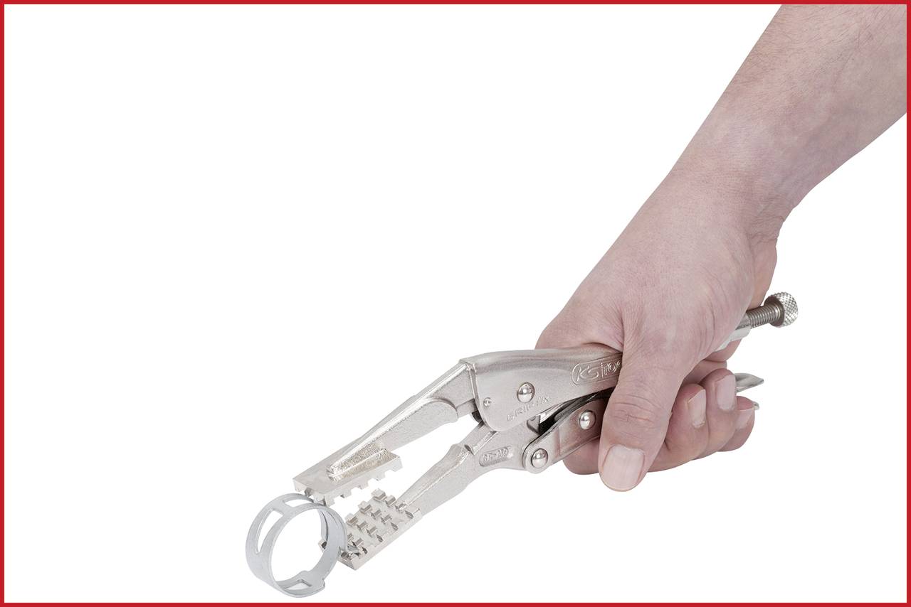 A hand is holding an adjustable pair of pliers gripping a round object. The pliers are made of metal and have a slight sheen.