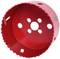 Red bi-metal hole saw attachment with serrated edge and multiple circular openings for drilling into metal or wood.