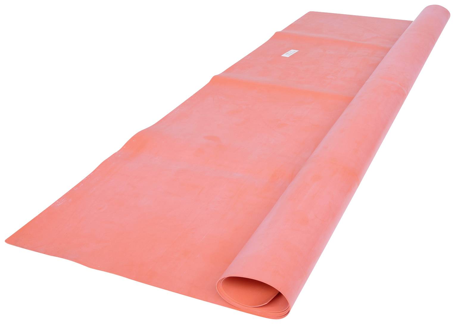 Red yoga mat rolled out on a white background, ready for fitness exercises or meditation.