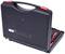 Black tool case with red locks, slightly open, revealing internal tools. Perfect for secure transportation.