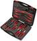 An open toolbox with various red hand tools, including screwdrivers, pliers, and voltage testers.