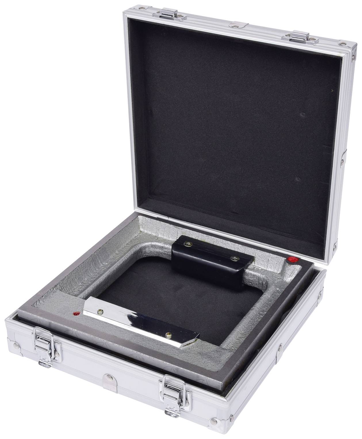 An open silver briefcase, lined with black padding inside, reveals a recess designed for the secure storage of an item.