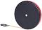 Round, black tape measure cover with a red border, tape measure is partially pulled out and has a loop at the end.