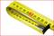 A yellow tape measure with the number '20' highlighted in red on a white background. It is arranged in a loop.