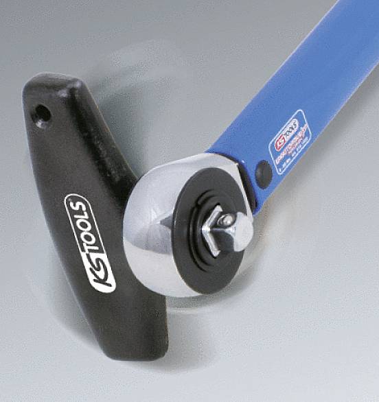 A blue KS Tools torque wrench with a black handle is shown in motion.