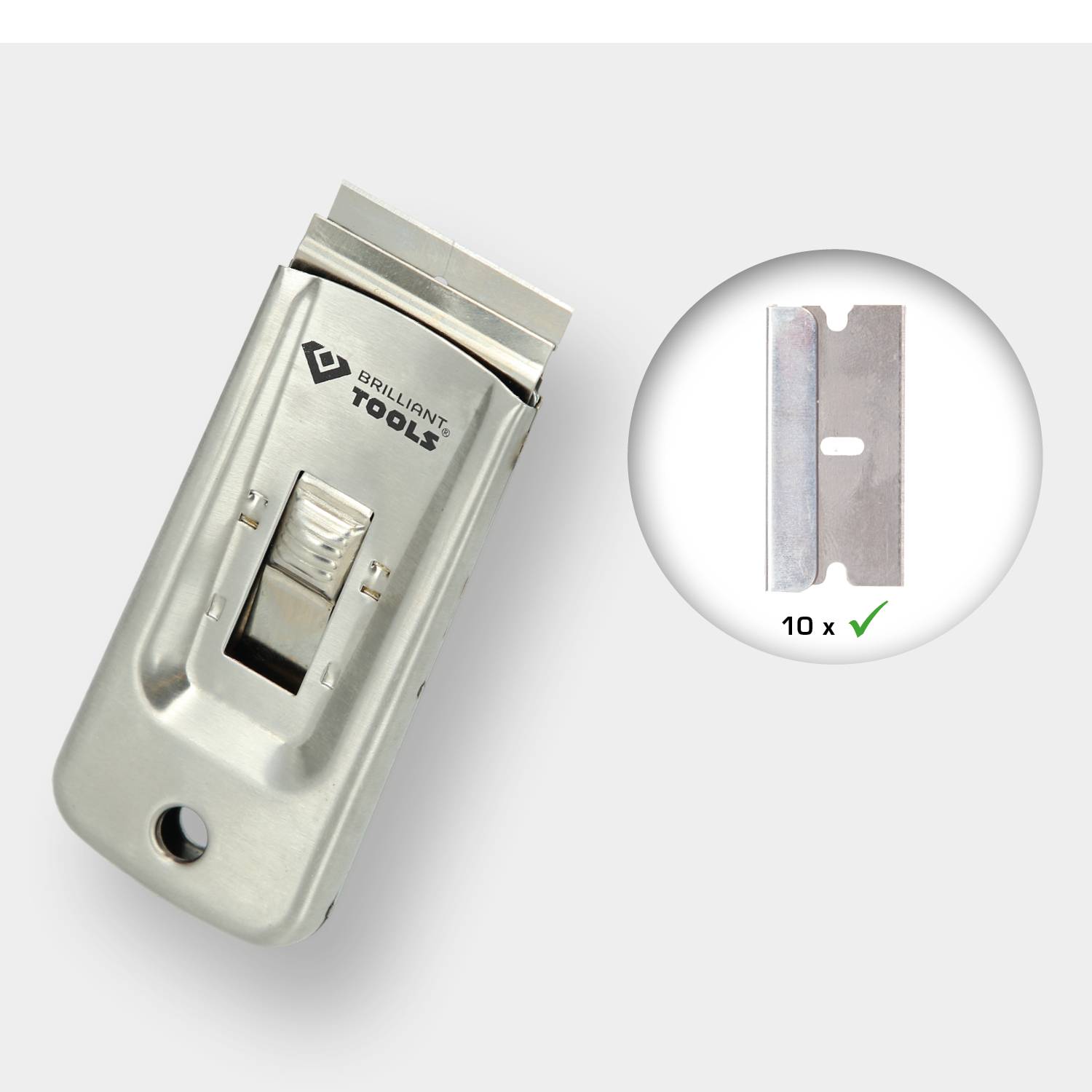 Silver glass scraper with a blade, next to a circle showing ten spare blades and a tick mark. Marking 'Tools'.