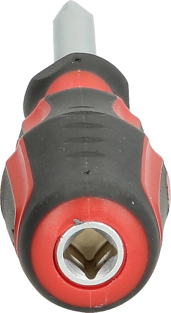 Close-up of a red and black screwdriver pointing towards the camera. The handle is rubber-coated for improved grip.
