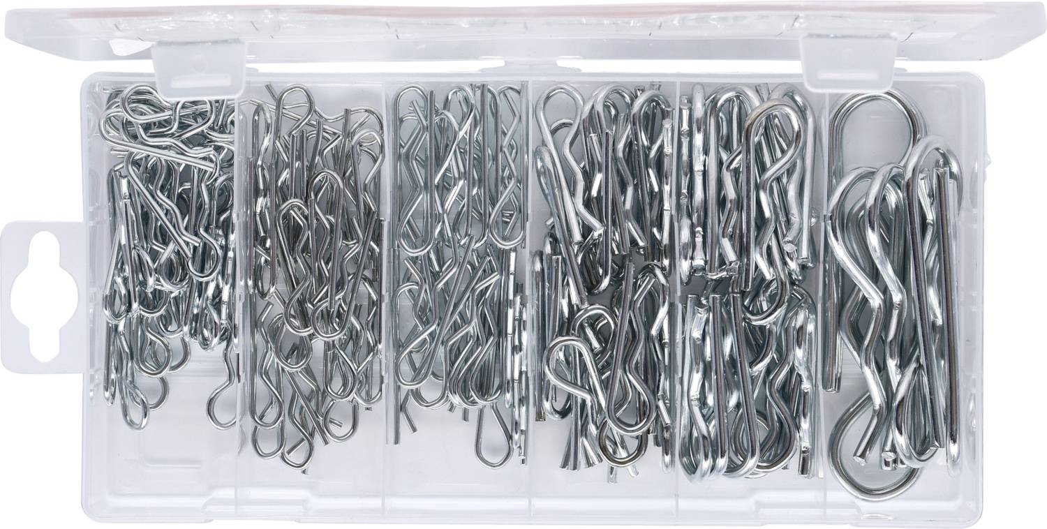 A transparent plastic container filled with silver drawing pins, neatly arranged in five compartments in various sizes.