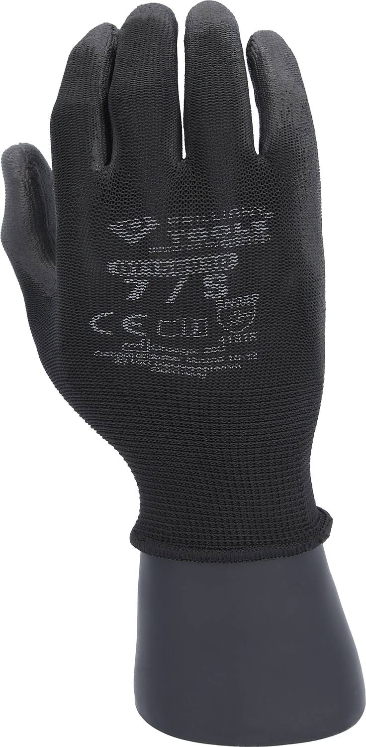 A black work glove on a plastic hand with safety symbols and markings on the back of the hand.