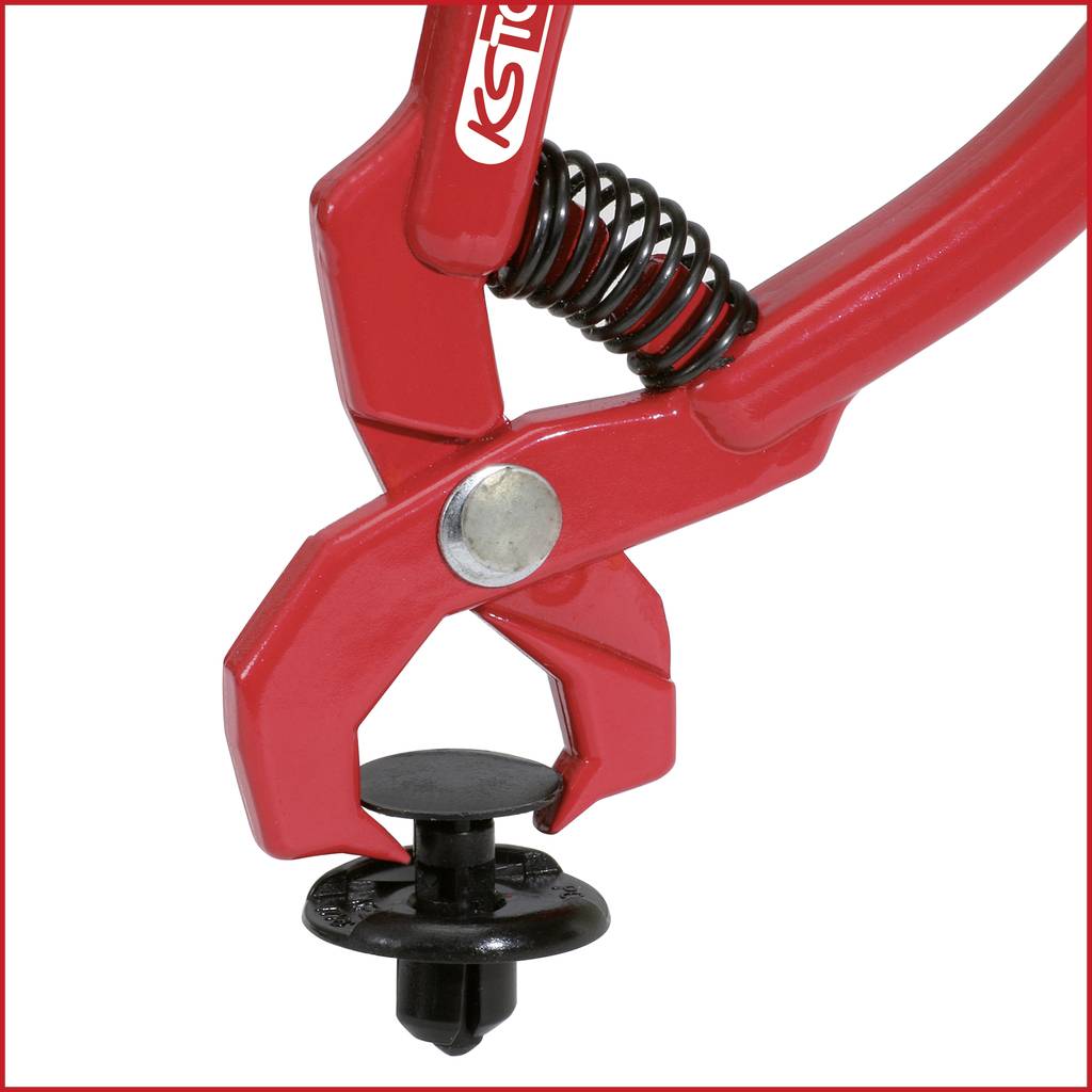 Red pliers with spring tension, opened to hold a black plastic clip. Brand name visible on the side. Tool in close-up.