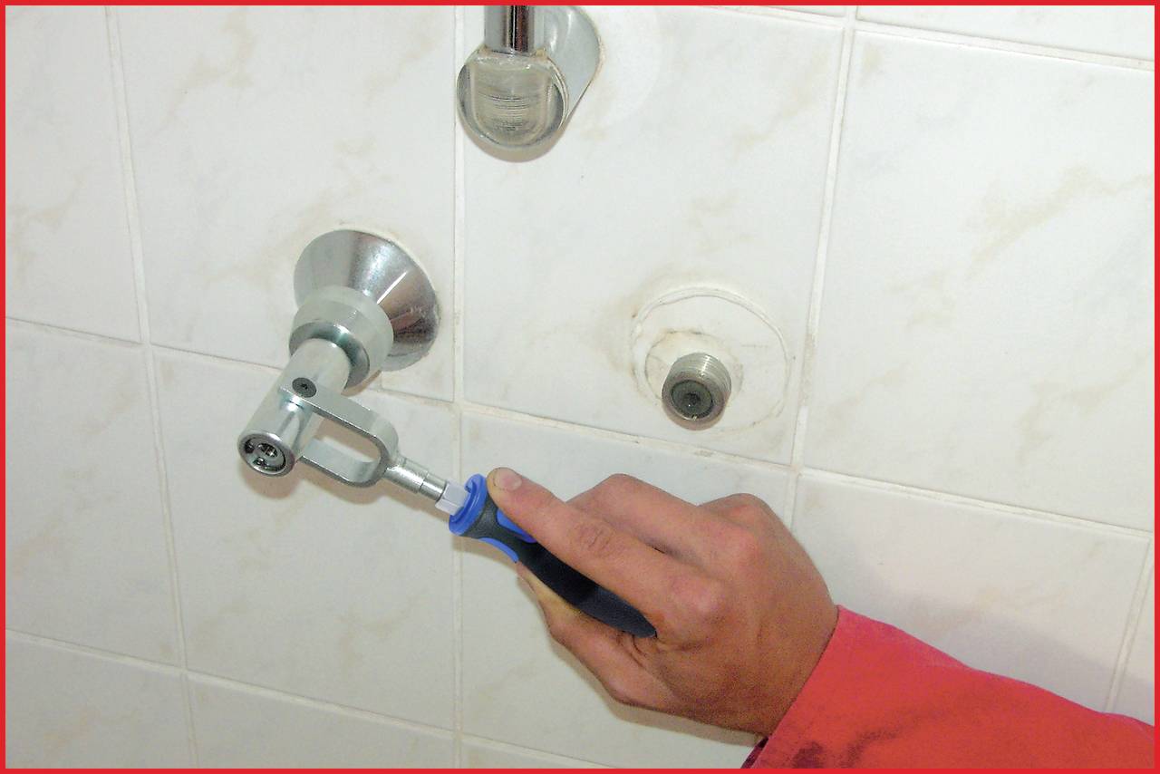 'Tap fitted with tool to water connection in bathroom tiles.'