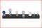 A black bar with six different metal valves and connections, featuring varied shapes and surfaces.