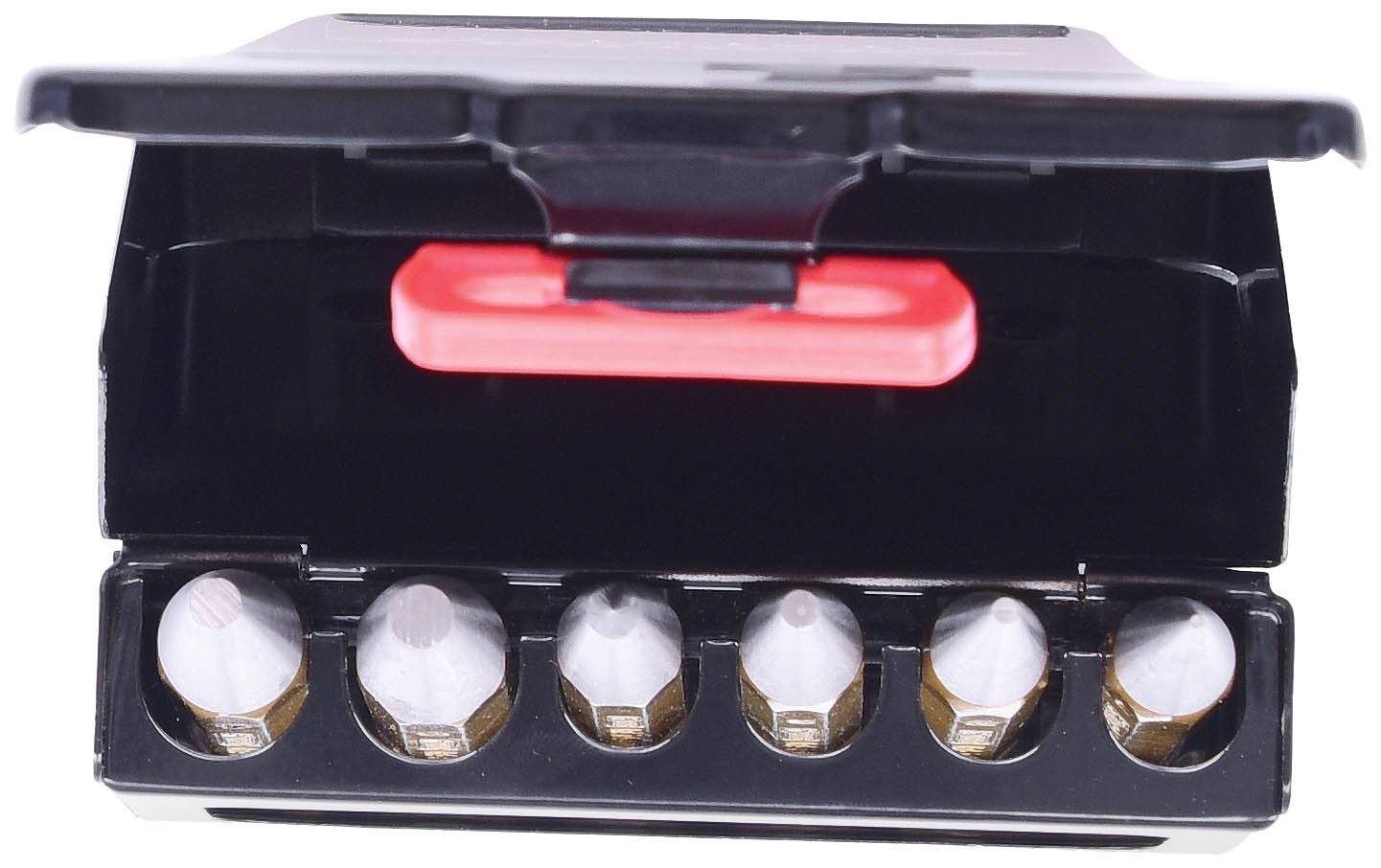 Six silver drill crowns in an open, black plastic container with a red lid.
