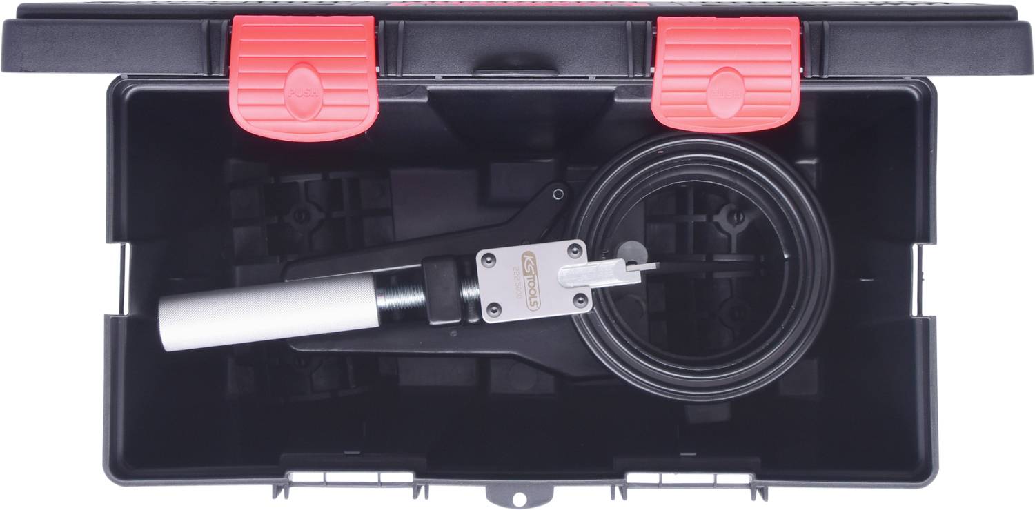 'Open black toolbox with an air pump pliers inside, surrounded by textured plastic surfaces.'