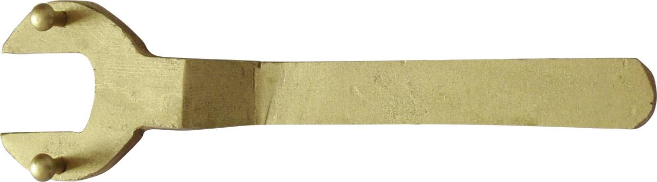 A golden-coloured spanner with an open jaw, lying on a white background.